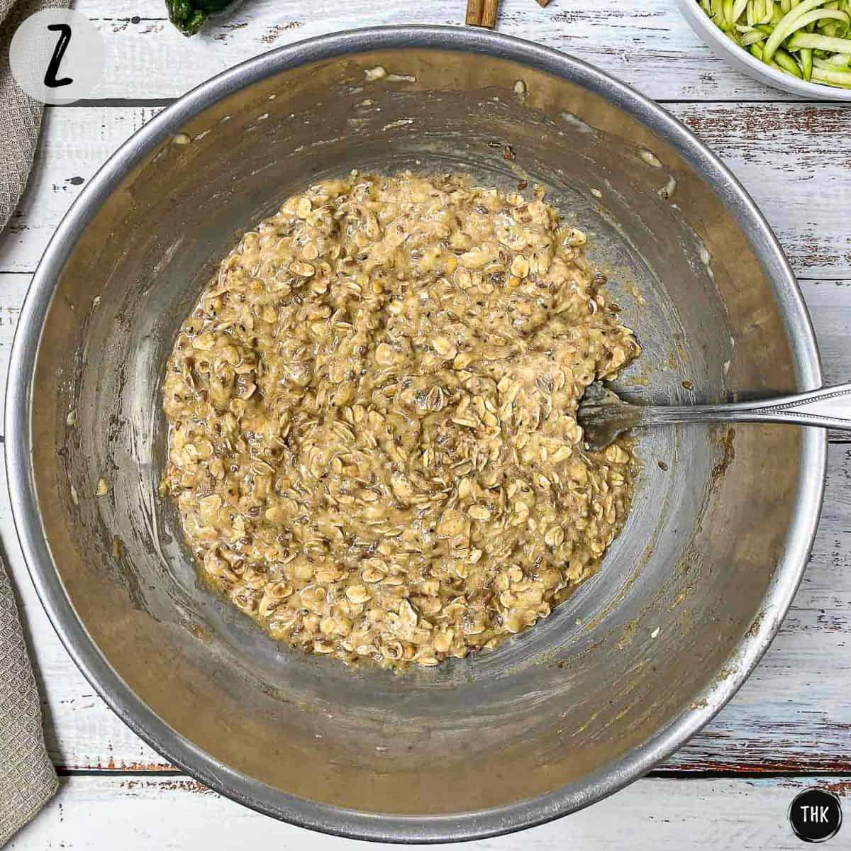 Cookie batter inside large mixing bowl.